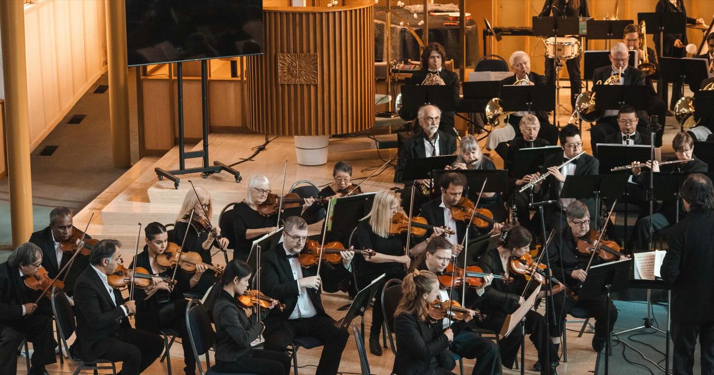 Ali and Yas performing with an orchestra